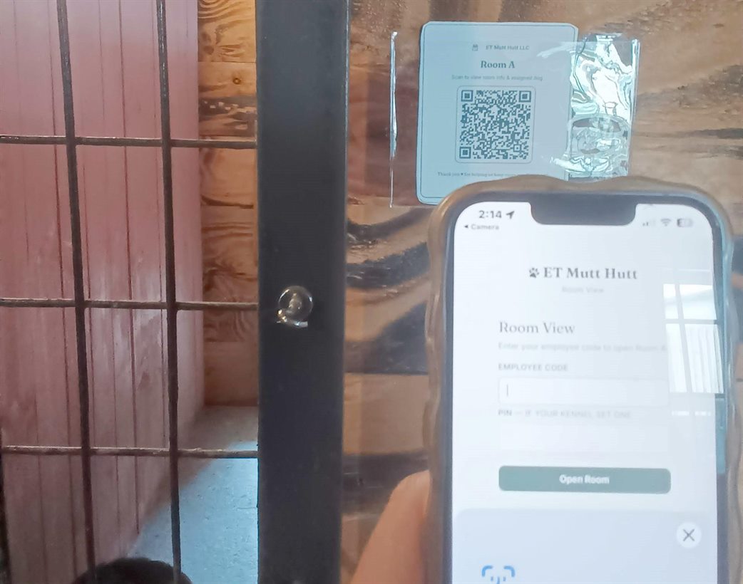 The room placard beside a phone asking for an employee code to open the room